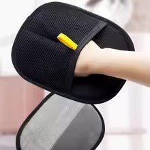 Black pet hair removal glove being held up – front view