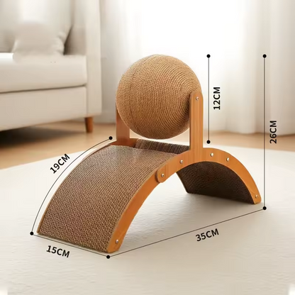 White cat scratching the curved cardboard ramp on wooden scratcher with sisal ball